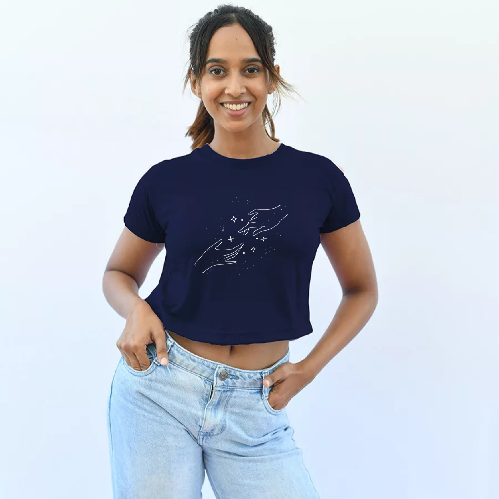Woman wearing a navy blue t-shirt with a graphic design with plane background